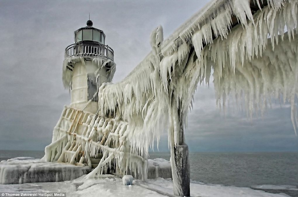 Picturesque: This lighthouse was captured in the city of St Joseph. The structures can remain frozen for over a month during particularly severe winters