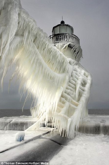 This frozen lighthouse in Michigan could easily be mistaken for a still from the snow swept disaster movie The Day After Tomorrow